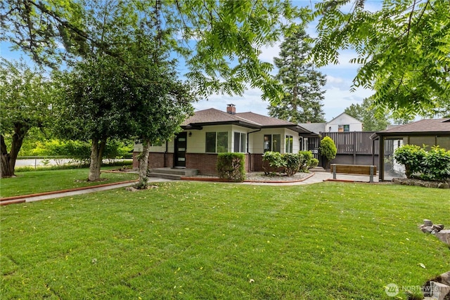 10303 40th Ave E, Tacoma, WA 98446 - bungalow-style home with brick siding, a front lawn, and a chimney