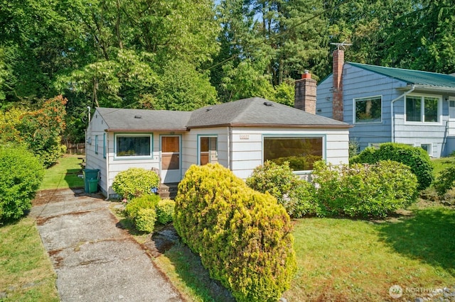 10022 8th Ave NE, Seattle, WA 98125 - bungalow-style home with a chimney, a front lawn, roof with shingles, and entry steps