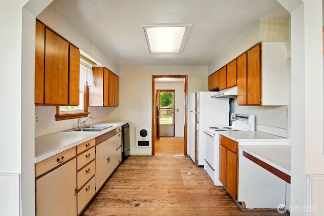 10022 8th Ave NE, Seattle, WA 98125 - kitchen with white appliances, under cabinet range hood, light countertops, light wood finished floors, and backsplash
