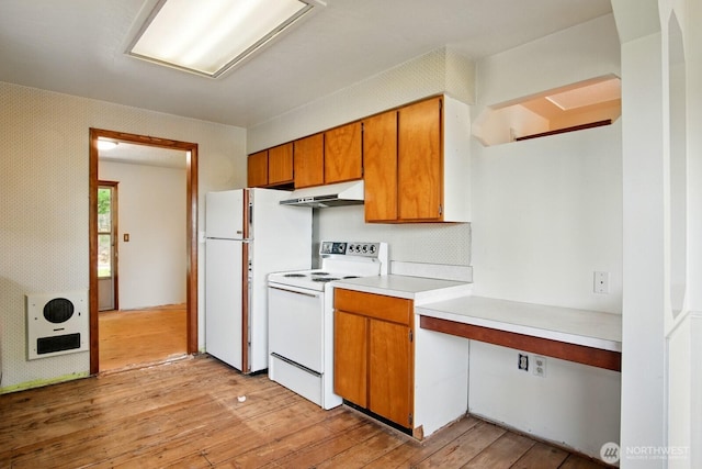 10022 8th Ave NE, Seattle, WA 98125 - kitchen with white appliances, under cabinet range hood, light wood-style floors, light countertops, and brown cabinets