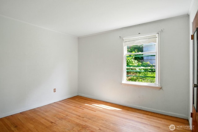 10022 8th Ave NE, Seattle, WA 98125 - empty room with wood finished floors and ornamental molding