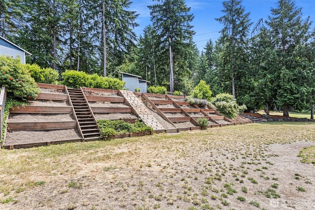 3288 NW Happy Hollow Ln, Silverdale, WA 98383 - view of yard featuring a vegetable garden and an outbuilding