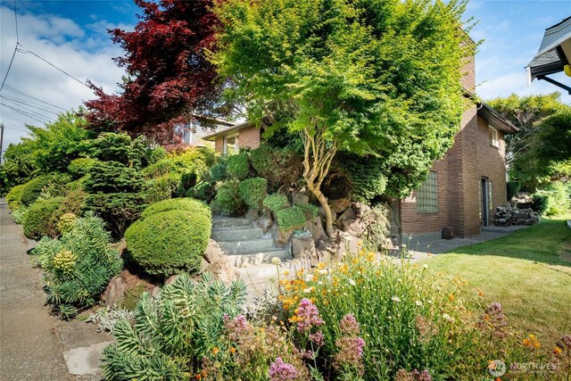 2842 NW 67th St, Seattle, WA 98117 - view of property exterior with brick siding and a yard
