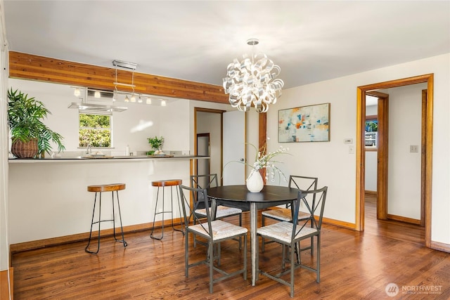 2842 NW 67th St, Seattle, WA 98117 - dining area featuring wood finished floors and a chandelier