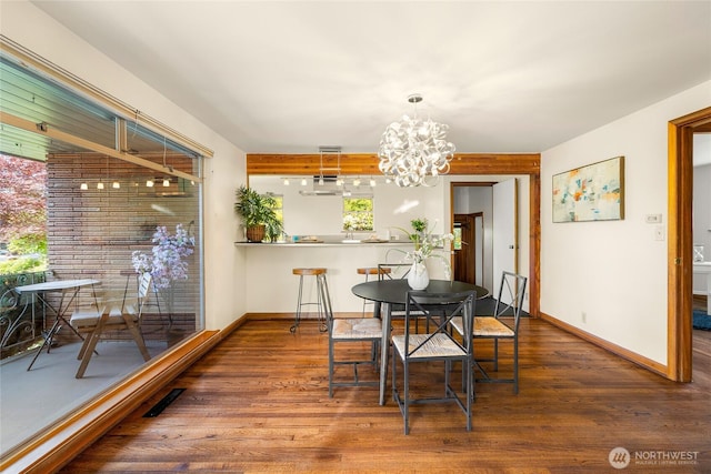 2842 NW 67th St, Seattle, WA 98117 - dining room featuring a chandelier and wood finished floors