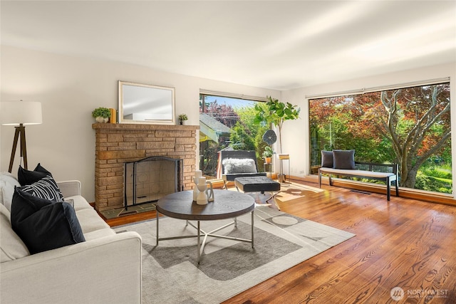 2842 NW 67th St, Seattle, WA 98117 - living room with a stone fireplace and wood finished floors