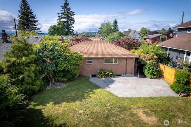 2842 NW 67th St, Seattle, WA 98117 - rear view of property with a tiled roof, a patio, a chimney, and a residential view