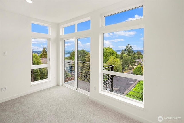 1244 15th Ave E Unit 9, Seattle, WA 98112 - unfurnished sunroom featuring carpet flooring and recessed lighting