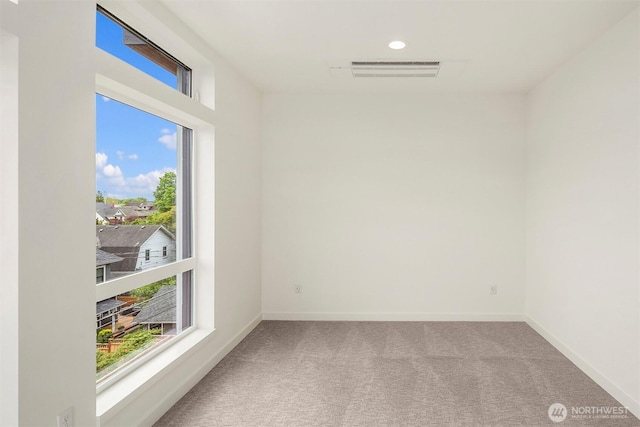 1244 15th Ave E Unit 9, Seattle, WA 98112 - carpeted empty room featuring plenty of natural light and recessed lighting