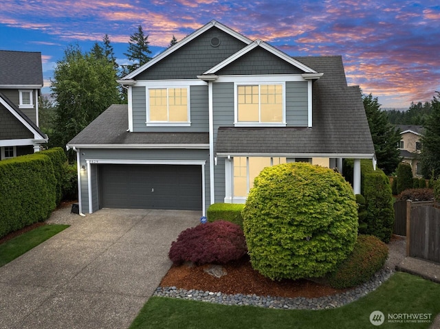 8829 138th Ct SE, Newcastle, WA 98059 - view of front of house with concrete driveway, an attached garage, and roof with shingles