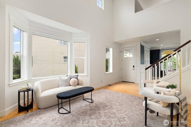 8829 138th Ct SE, Newcastle, WA 98059 - entrance foyer with wood finished floors, stairs, and a towering ceiling