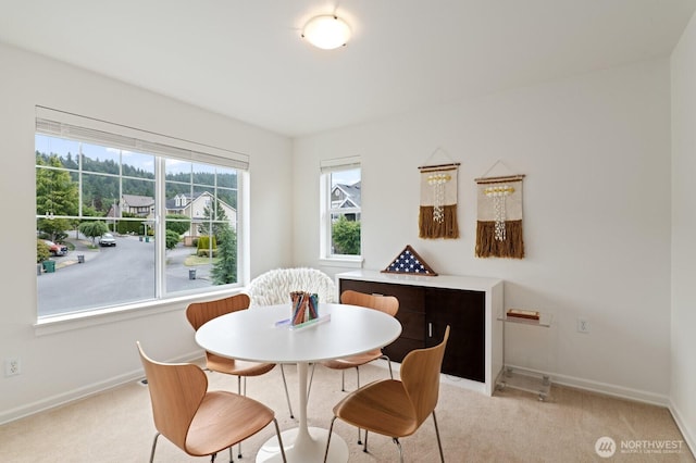 8829 138th Ct SE, Newcastle, WA 98059 - dining room featuring light carpet and baseboards