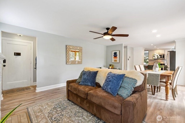 4431 SW Kenyon Pl, Seattle, WA 98136 - living room with a ceiling fan, light wood finished floors, and recessed lighting