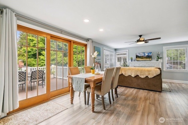 4431 SW Kenyon Pl, Seattle, WA 98136 - dining room with light wood finished floors, ceiling fan, and recessed lighting