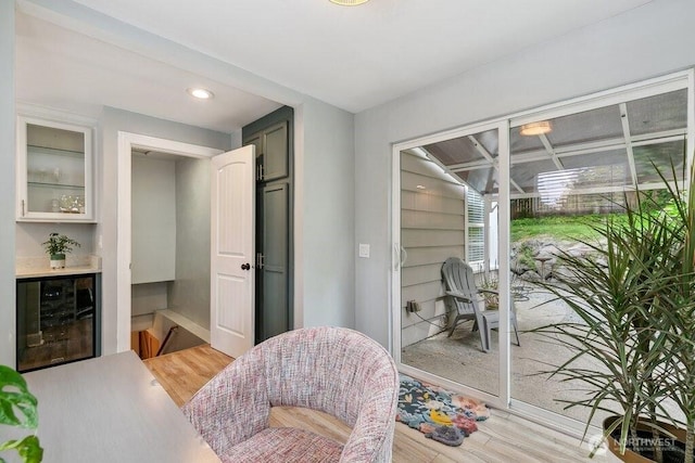 4431 SW Kenyon Pl, Seattle, WA 98136 - living area with beverage cooler, light wood-style flooring, and recessed lighting