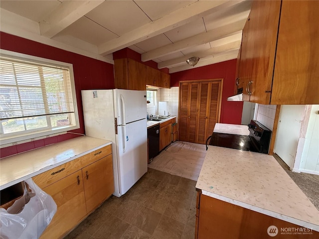 1309 29th St, Anacortes, WA 98221 - kitchen with range with electric cooktop, freestanding refrigerator, black dishwasher, and light countertops
