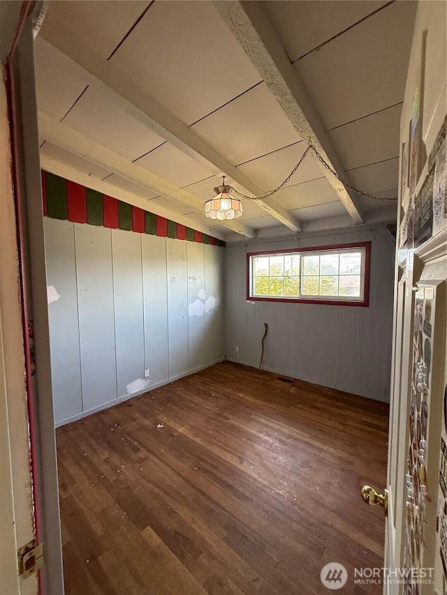1309 29th St, Anacortes, WA 98221 - spare room with wood finished floors and beamed ceiling