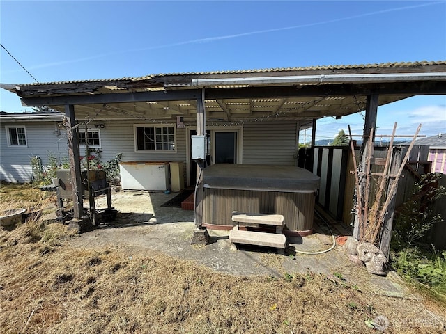 1309 29th St, Anacortes, WA 98221 - rear view of house with a hot tub