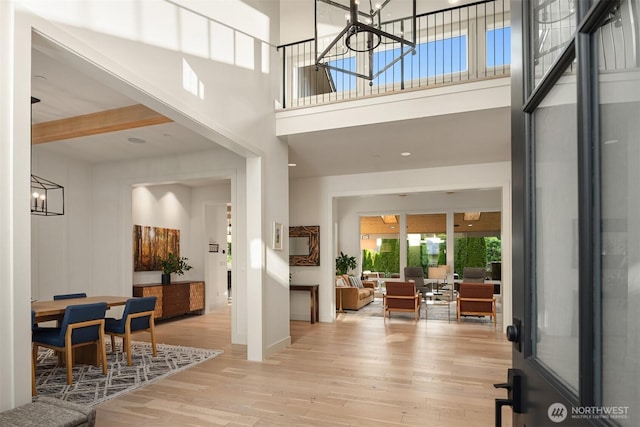 4405 88th Ave SE, Mercer Island, WA 98040 - foyer entrance featuring wood finished floors, a chandelier, and a towering ceiling