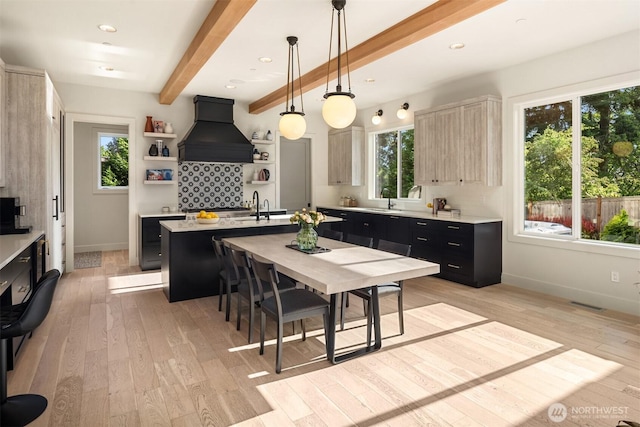 4405 88th Ave SE, Mercer Island, WA 98040 - kitchen featuring custom range hood, open shelves, light countertops, healthy amount of natural light, and beam ceiling
