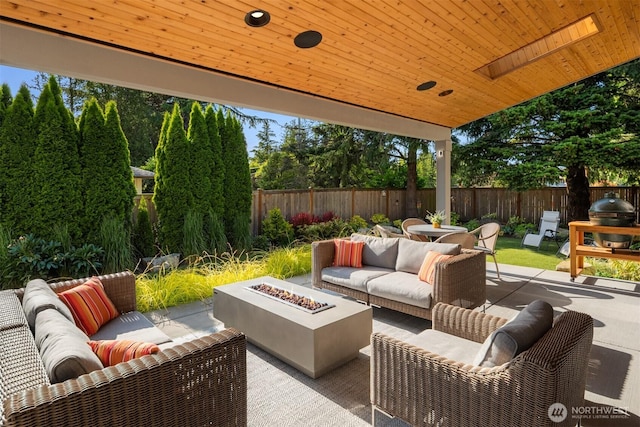 4405 88th Ave SE, Mercer Island, WA 98040 - fenced backyard featuring an outdoor living space with a fire pit and a patio area