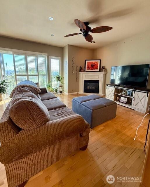 2103 Tacoma Ct, Tacoma, WA 98405 - living room featuring a glass covered fireplace, a ceiling fan, and wood finished floors