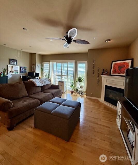2103 Tacoma Ct, Tacoma, WA 98405 - living room with a glass covered fireplace, ceiling fan, light wood-style flooring, and recessed lighting