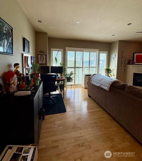 2103 Tacoma Ct, Tacoma, WA 98405 - living area featuring light wood-style flooring, an office area, recessed lighting, and a fireplace