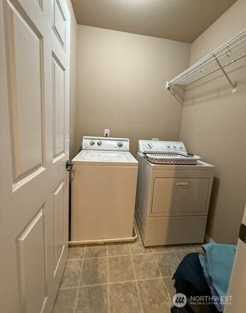 2103 Tacoma Ct, Tacoma, WA 98405 - laundry area featuring washer and clothes dryer and light tile patterned flooring