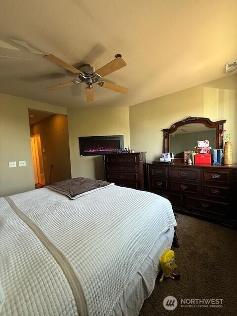 2103 Tacoma Ct, Tacoma, WA 98405 - bedroom with dark carpet and a ceiling fan