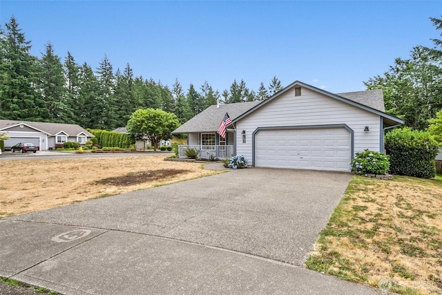 7609 39th Ct SE, Lacey, WA 98503 - ranch-style house featuring covered porch, driveway, an attached garage, and roof with shingles