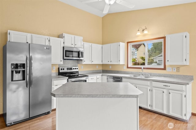 7609 39th Ct SE, Lacey, WA 98503 - kitchen with appliances with stainless steel finishes, light wood-style floors, white cabinetry, a ceiling fan, and high vaulted ceiling