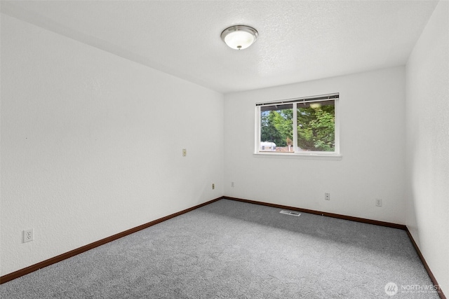 7609 39th Ct SE, Lacey, WA 98503 - spare room featuring carpet