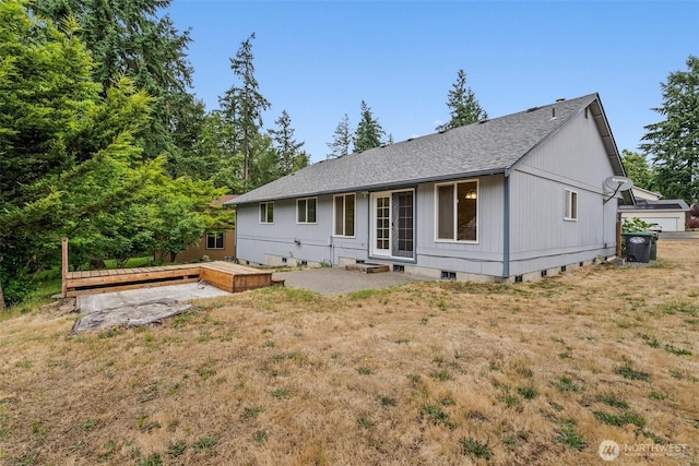 7609 39th Ct SE, Lacey, WA 98503 - rear view of property featuring a deck, a shingled roof, and a yard