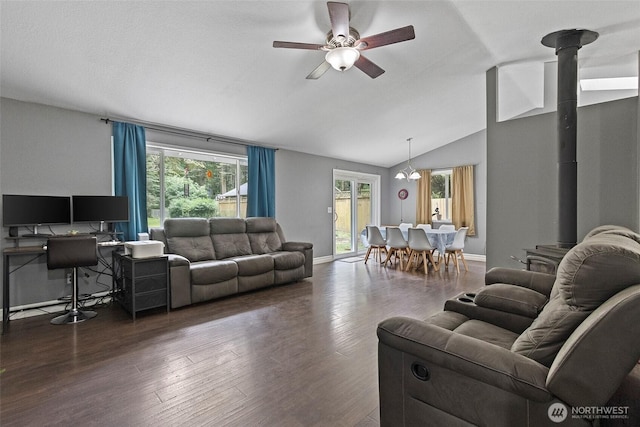 2253 Wellman Pl, Oak Harbor, WA 98277 - living area featuring a wood stove, a ceiling fan, lofted ceiling, healthy amount of natural light, and dark wood-style floors