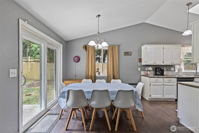 2253 Wellman Pl, Oak Harbor, WA 98277 - dining area with lofted ceiling, a chandelier, and dark wood-style floors