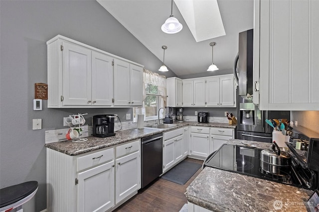 2253 Wellman Pl, Oak Harbor, WA 98277 - kitchen featuring dishwashing machine, a skylight, vaulted ceiling, white cabinets, and stove