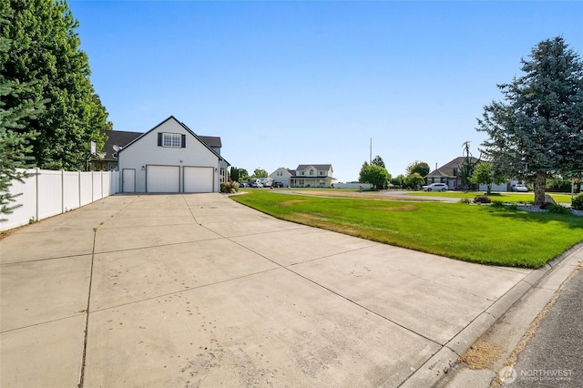 5476 Lorri Ln, Moses Lake, WA 98837 - view of front of home with driveway, a garage, and a residential view