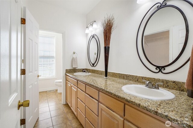 5476 Lorri Ln, Moses Lake, WA 98837 - bathroom with double vanity and tile patterned floors