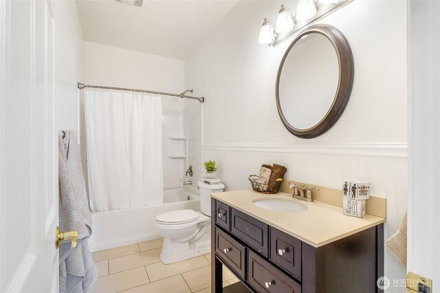 5476 Lorri Ln, Moses Lake, WA 98837 - bathroom featuring shower / tub combo, vanity, tile patterned flooring, and a wainscoted wall