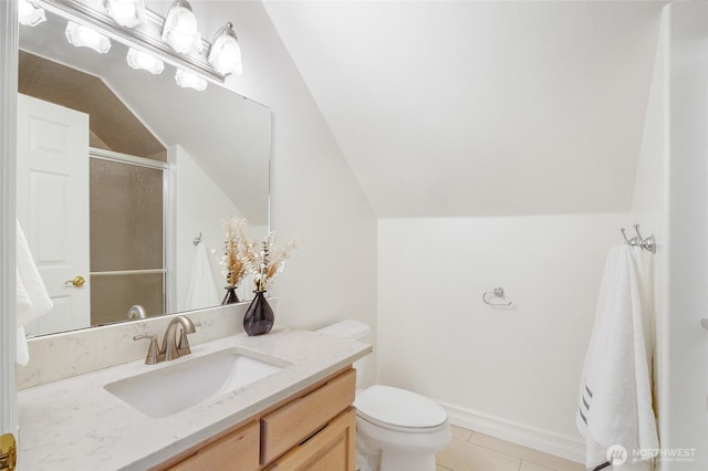 5476 Lorri Ln, Moses Lake, WA 98837 - bathroom with lofted ceiling, vanity, an enclosed shower, and tile patterned flooring