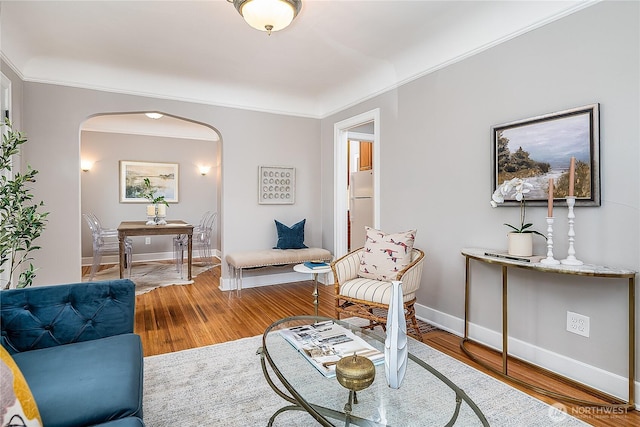 8047 Earl Ave NW, Seattle, WA 98117 - living area featuring arched walkways, wood finished floors, and crown molding