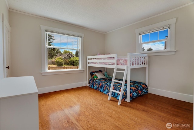 5111 N 39th St, Tacoma, WA 98407 - bedroom with crown molding, multiple windows, and wood finished floors