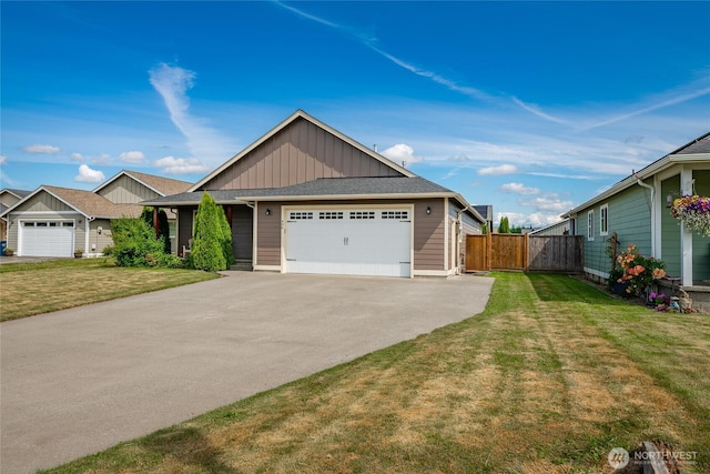 406 Harrison Ln, Nooksack, WA 98276 - view of front of home with board and batten siding, an attached garage, driveway, and roof with shingles