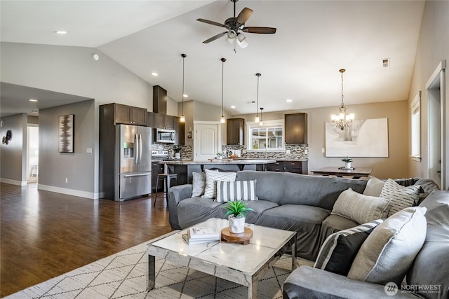 406 Harrison Ln, Nooksack, WA 98276 - living room with ceiling fan, dark wood finished floors, a chandelier, high vaulted ceiling, and recessed lighting