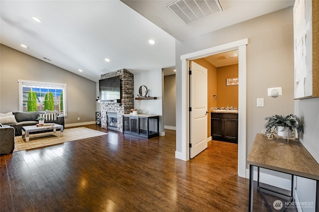 406 Harrison Ln, Nooksack, WA 98276 - living room featuring dark wood finished floors, lofted ceiling, a fireplace, and recessed lighting