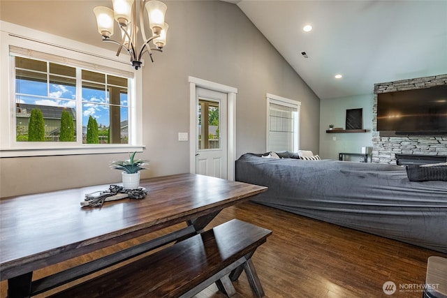 406 Harrison Ln, Nooksack, WA 98276 - dining space featuring a chandelier, high vaulted ceiling, recessed lighting, dark wood-style floors, and a fireplace