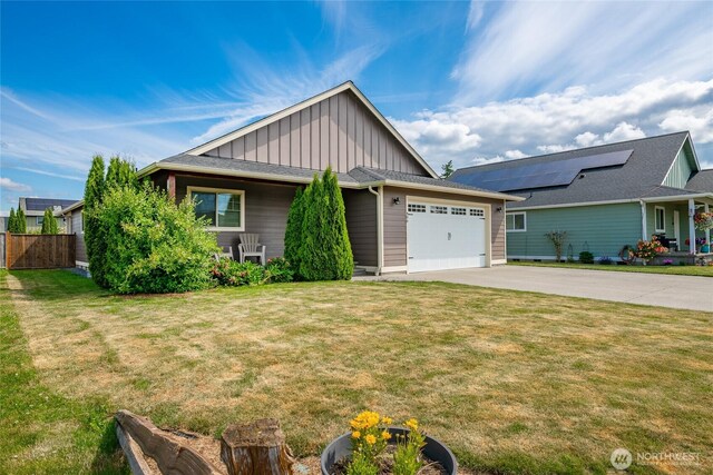 406 Harrison Ln, Nooksack, WA 98276 - view of front facade with board and batten siding, an attached garage, and driveway