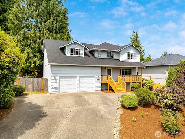632 97th Ave SE, Lake Stevens, WA 98258 - view of front of home featuring concrete driveway, a garage, stairs, a shingled roof, and a porch