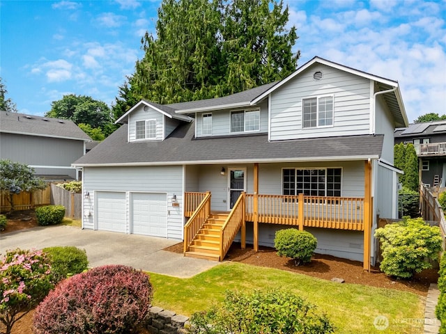 632 97th Ave SE, Lake Stevens, WA 98258 - traditional-style home with driveway, a shingled roof, and covered porch